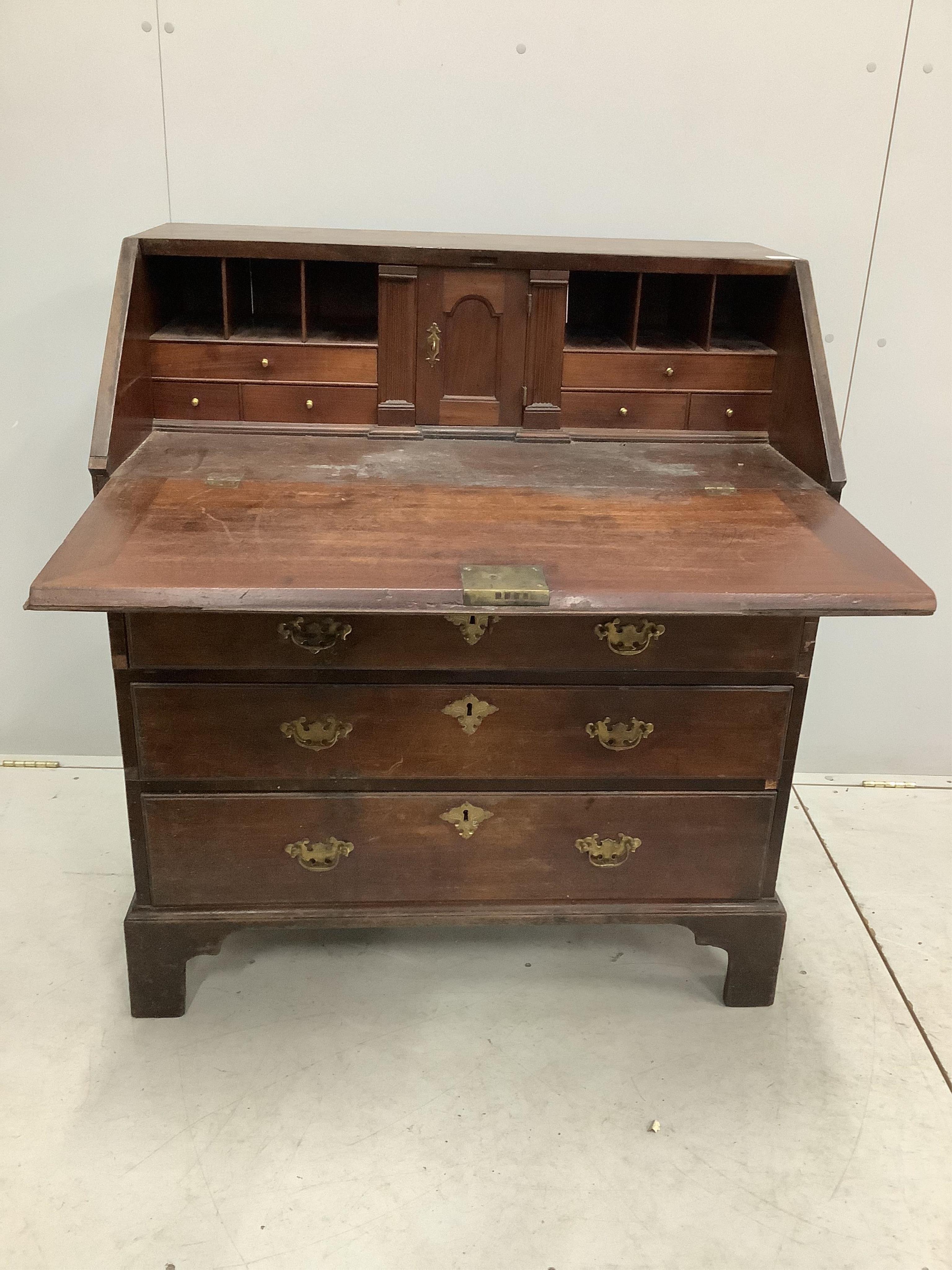 A George III mahogany bureau, width 96cm, depth 56cm, height 106cm. Condition - poor to fair, top with two areas of lost moulding